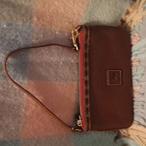 Dooney and Bourke Large wristlet in Chestnut Florentine leather